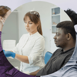 Dentist reviewing digital X-ray with patient